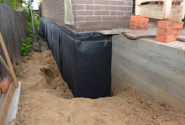 SJ Waterproofing Pros technician performing targeted Vapor Barrier Installation assessment in Kingsford Heights, IN